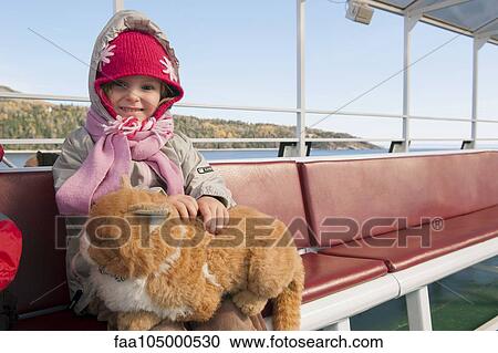 Little girl sitting on ferry boat with stuffed cat on her lap, portrait View Large Photo Image Stock Image - Little girl sitting on ferry boat with stuffed cat on her lap, portrait. Fotosearch