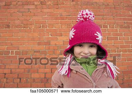 Little girl wearing knit hat outdoors, portrait View Large Photo Image Stock Image - Little girl wearing knit hat outdoors, portrait. Fotosearch