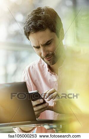 Man receiving text message View Large Photo Image Stock Image - Man receiving text message. Fotosearch