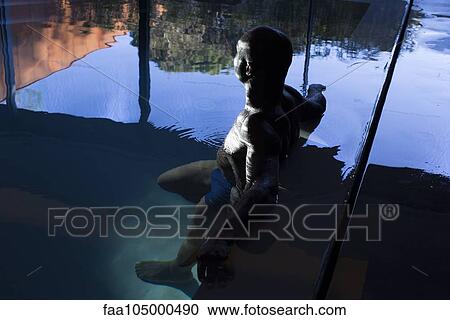 Man relaxing in indoor pool View Large Photo Image Stock Image - Man relaxing in indoor pool. Fotosearch