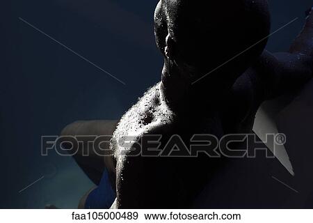 Stock Photo - Man relaxing in pool. Fotosearch