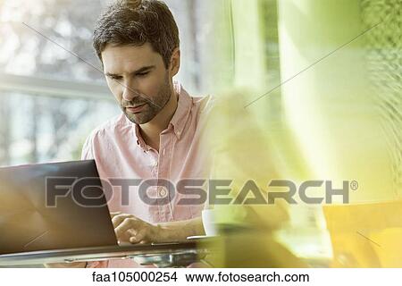 Man using laptop computer View Large Photo Image Picture - Man using laptop computer. Fotosearch