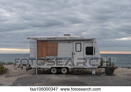 Motor home parked beside beach View Large Photo Image Stock Photo - Motor home parked beside beach. Fotosearch