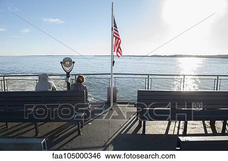 Passengers on ferry boat deck View Large Photo Image Stock Photograph - Passengers on ferry boat deck. Fotosearch