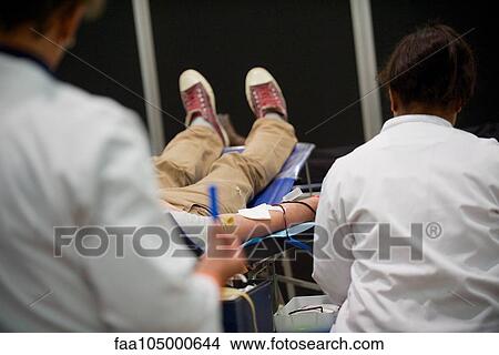 Person donating blood, cropped View Large Photo Image Picture - Person donating blood, cropped. Fotosearch