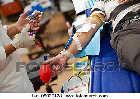 Person donating blood, cropped View Large Photo Image Stock Photo - Person donating blood, cropped. Fotosearch