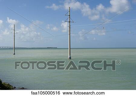 Power lines in the sea View Large Photo Image Stock Photograph - Power lines in the sea. Fotosearch
