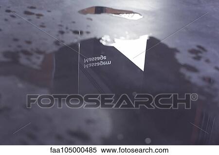 Puddle with reflection of sign reading massage View Large Photo Image Stock Photography - Puddle with reflection of sign reading massage. Fotosearch