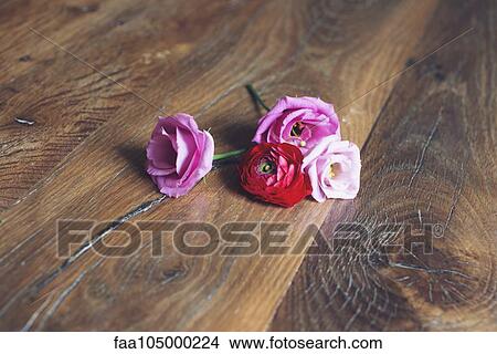 Roses on wooden table View Large Photo Image Picture - Roses on wooden table. Fotosearch