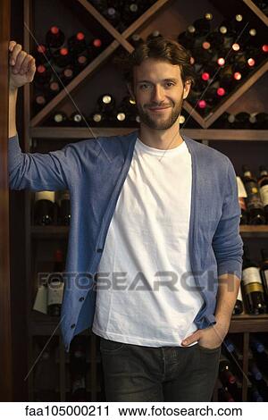 Salesman in wine shop, portrait View Large Photo Image Stock Image - Salesman in wine shop, portrait. Fotosearch