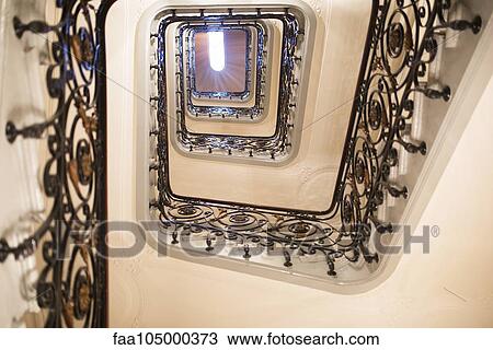 Stock Image - Spiral staircase, low angle view. Fotosearch