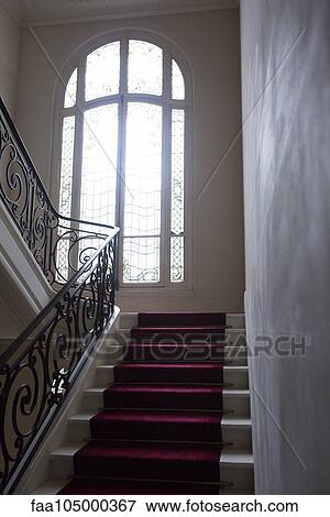 Stairway with wrought iron bannister View Large Photo Image Stock Photo - Stairway with wrought iron bannister. Fotosearch