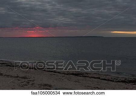 Picture - Sunset turning into twilight at the beach. Fotosearch