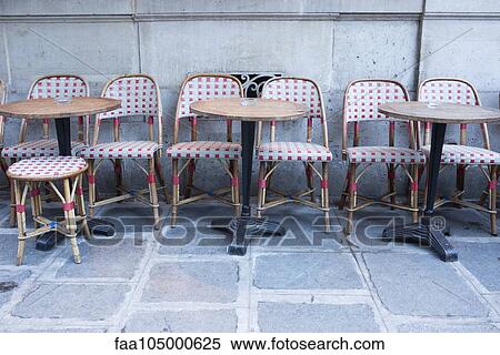 Tables and chairs at empty sidewalk cafe View Large Photo Image Stock Photography - Tables and chairs at empty sidewalk cafe. Fotosearch