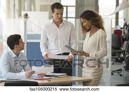 Stock Photography - Team meeting in manager's office. Fotosearch