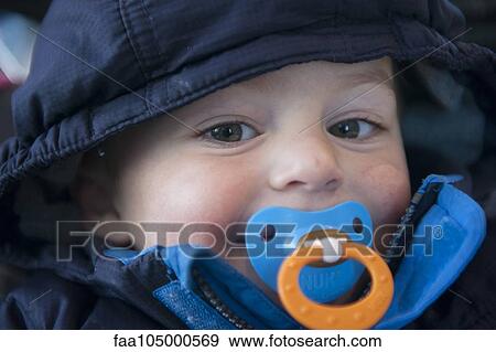 Toddler boy with pacifier in his mouth, portrait View Large Photo Image Stock Photo - Toddler boy with pacifier in his mouth, portrait. Fotosearch