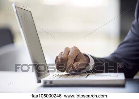Stock Photograph - Using laptop computer. Fotosearch