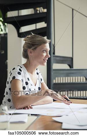 Woman at work explaining plans to colleague out of frame View Large Photo Image Stock Photograph - Woman at work explaining plans to colleague out of frame. Fotosearch