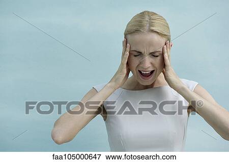 Woman holding head and screaming with eyes closed View Large Photo Image Stock Photo - Woman holding head and screaming with eyes closed. Fotosearch