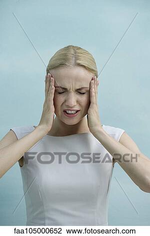 Woman holding head in frustration View Large Photo Image Stock Image - Woman holding head in frustration. Fotosearch