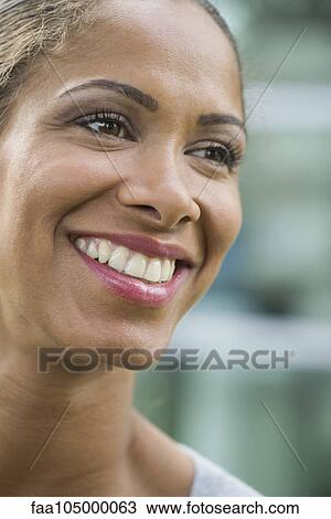 Woman smiling cheerfully, portrait View Large Photo Image Stock Image - Woman smiling cheerfully, portrait. Fotosearch