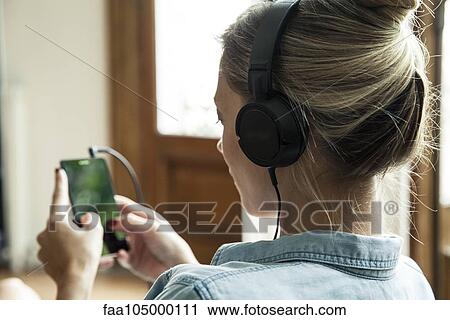 Stock Image - Woman text messaging. Fotosearch
