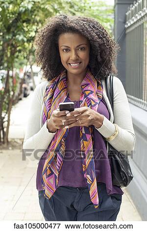Woman using cell phone, portrait View Large Photo Image Stock Photo - Woman using cell phone, portrait. Fotosearch