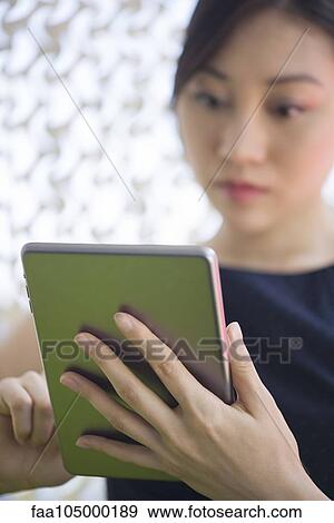 Woman using digital tablet View Large Photo Image Stock Photo - Woman using digital tablet. Fotosearch