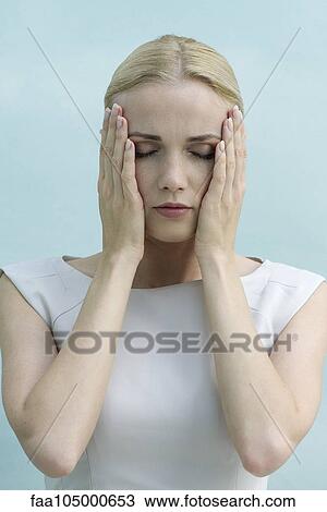 Woman with hands on face, eyes closed View Large Photo Image Stock Image - Woman with hands on face, eyes closed. Fotosearch