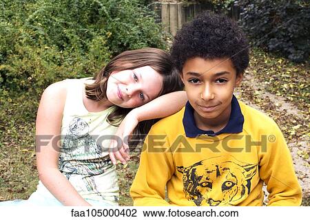 Young friends together outdoors, portrait View Large Photo Image Stock Image - Young friends together outdoors, portrait. Fotosearch