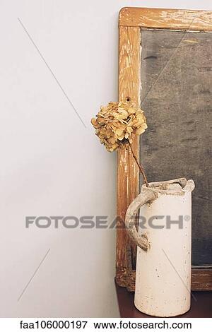 Antique water pitcher containing dried flowers View Large Photo Image Stock Photo - Antique water pitcher containing dried flowers. Fotosearch