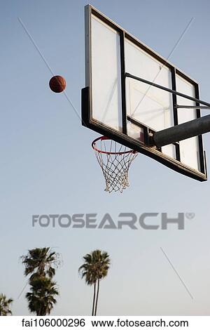 Basketball being thrown toward basketball hoop View Large Photo Image Stock Photograph - Basketball being thrown toward basketball hoop. Fotosearch