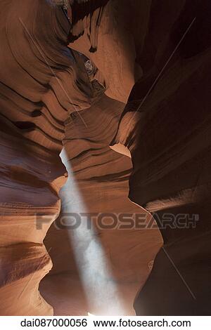 Stock Photograph - Beam of sunlight shining into Antelope Canyon, Arizona, USA. Fotosearch