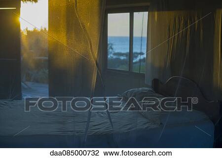 Bed with mosquito netting View Large Photo Image Stock Image - Bed with mosquito netting. Fotosearch
