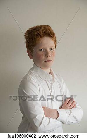 Boy with arms folded, portrait View Large Photo Image Stock Image - Boy with arms folded, portrait. Fotosearch