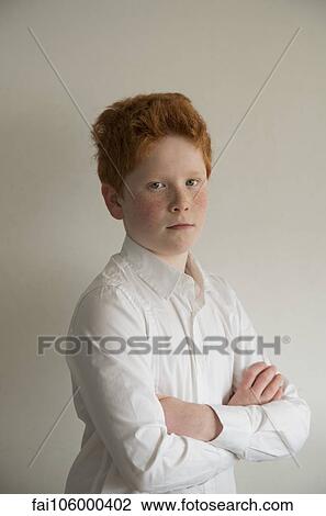 Boy with arms folded, portrait View Large Photo Image Stock Image - Boy with arms folded, portrait. Fotosearch