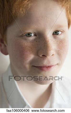 Stock Photograph - Boy with red hair and freckles, portrait. Fotosearch