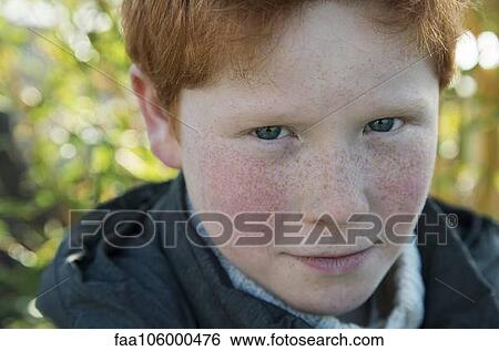 Boy with red hair and freckles, portrait View Large Photo Image Stock Photograph - Boy with red hair and freckles, portrait. Fotosearch