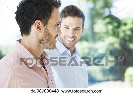 Stock Photo - Business colleagues chatting. Fotosearch