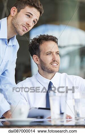 Picture - Business partners collaborating. Fotosearch