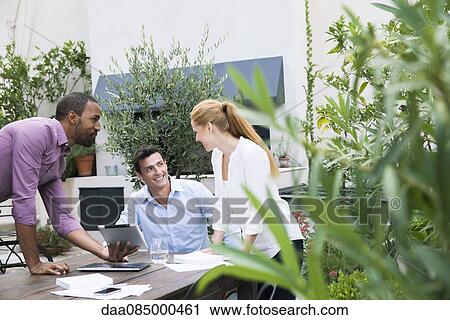 Business team working together on project View Large Photo Image Stock Image - Business team working together on project. Fotosearch