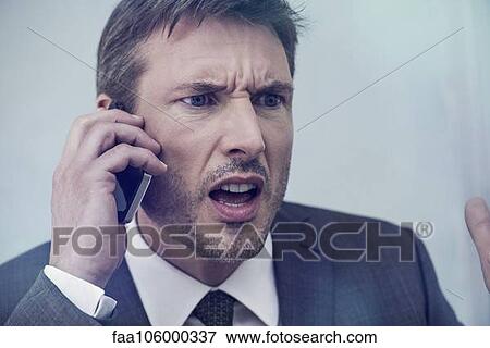 Businessman arguing on cell phone View Large Photo Image Stock Photo - Businessman arguing on cell phone. Fotosearch