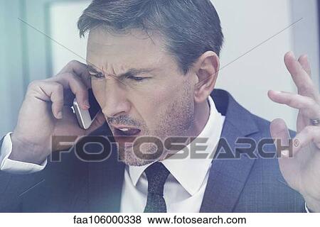 Businessman arguing on cell phone View Large Photo Image Stock Photo - Businessman arguing on cell phone. Fotosearch