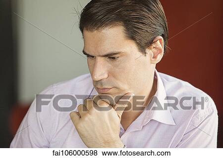 Businessman deep in thought View Large Photo Image Stock Photo - Businessman deep in thought. Fotosearch