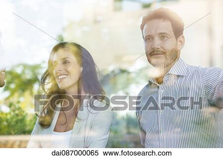 Businessman distracting during informal business meeting View Large Photo Image Stock Photography - Businessman distracting during informal business meeting. Fotosearch