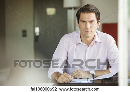 Businessman in office, portrait View Large Photo Image Stock Image - Businessman in office, portrait. Fotosearch