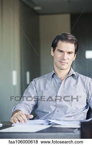 Businessman in office, portrait View Large Photo Image Stock Photo - Businessman in office, portrait. Fotosearch