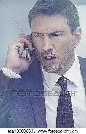 Businessman receiving bad news by cell phone View Large Photo Image Stock Photography - Businessman receiving bad news by cell phone. Fotosearch