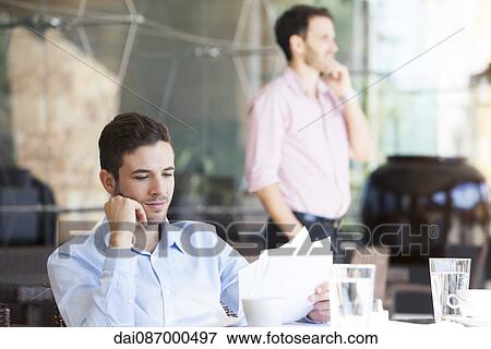 Businessman reviewing contract View Large Photo Image Stock Photo - Businessman reviewing contract. Fotosearch