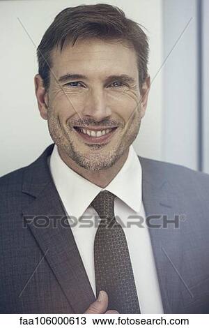 Businessman smiling, portrait View Large Photo Image Stock Image - Businessman smiling, portrait. Fotosearch